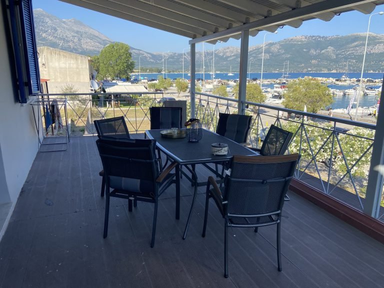 Balcony seating with views of the harbour and mountains, upper sea-view apartment, Aphrodite Apartments Mytikas